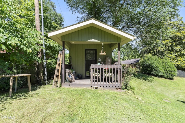 view of outbuilding with a yard