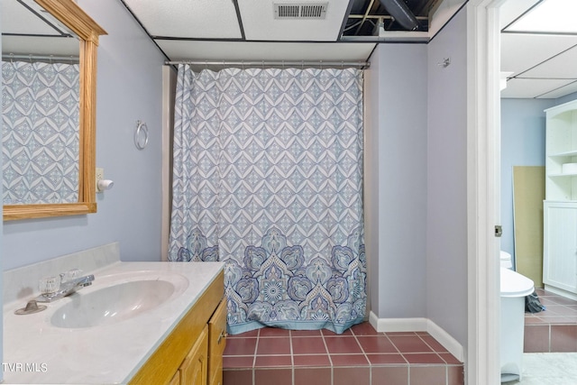 bathroom featuring tile patterned floors, toilet, and vanity