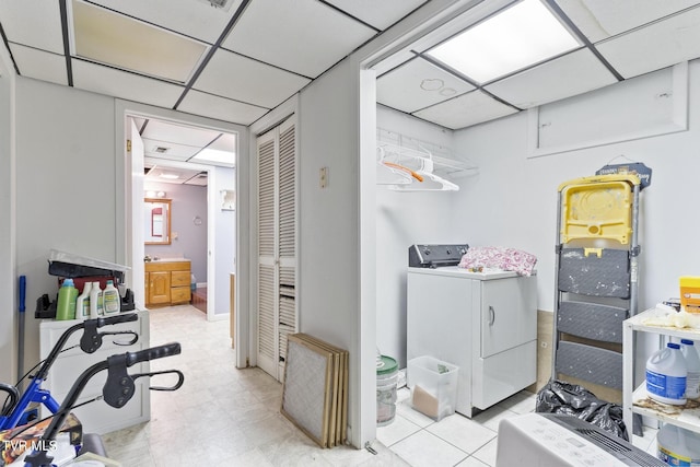 interior space with washer / dryer and a drop ceiling