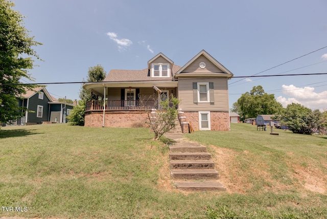 view of front of home featuring a front lawn and covered porch