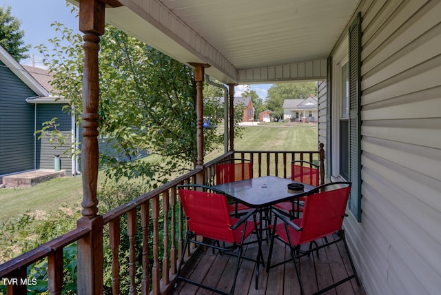 wooden terrace with a yard