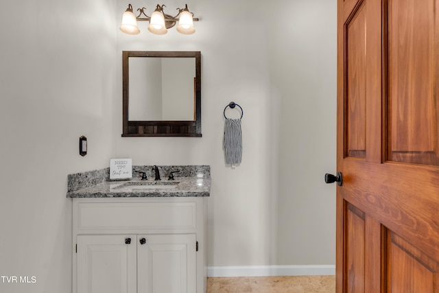 bathroom featuring vanity and baseboards