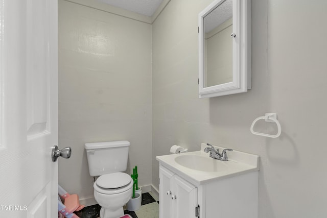 half bathroom featuring toilet and vanity