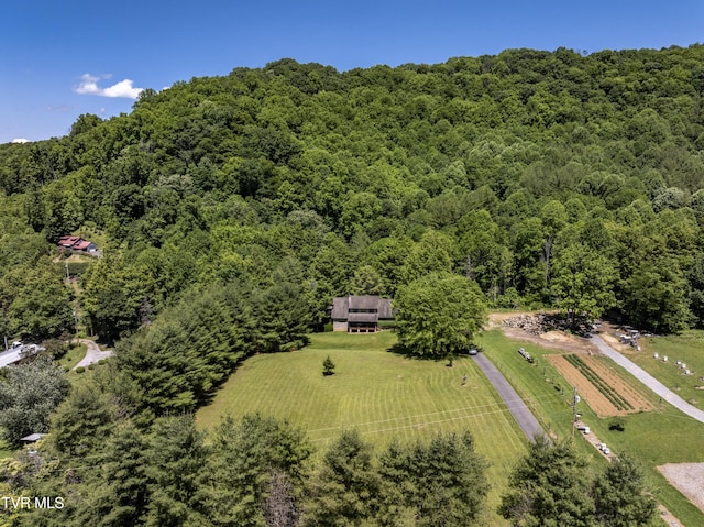 birds eye view of property with a rural view