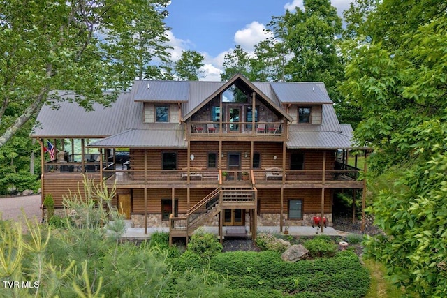 back of house with a wooden deck