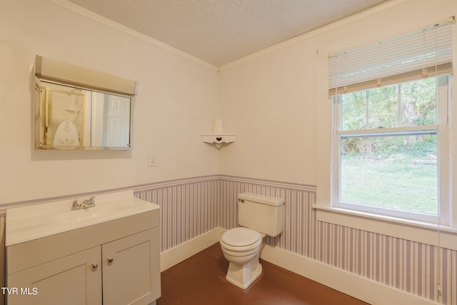 bathroom featuring vanity, a textured ceiling, hardwood / wood-style flooring, ornamental molding, and toilet