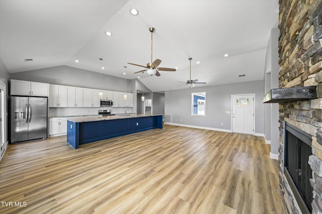 2137 Rainwater Rd, Dandridge, TN 37725 - kitchen with appliances with stainless steel finishes, recessed lighting, open floor plan, white cabinetry, and ceiling fan