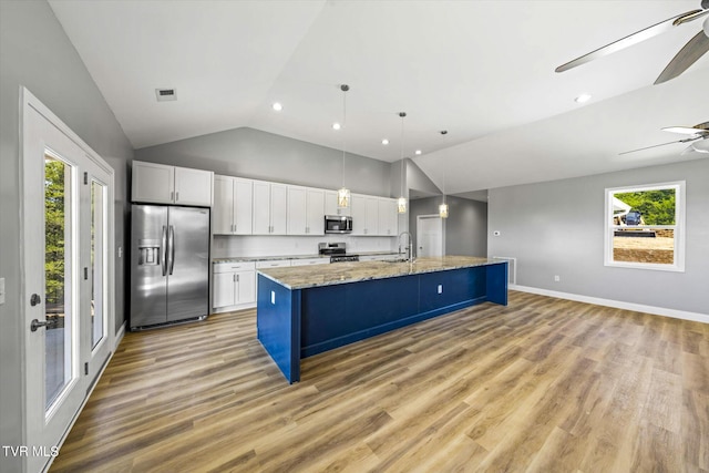 2137 Rainwater Rd, Dandridge, TN 37725 - kitchen featuring stainless steel appliances, lofted ceiling, a sink, recessed lighting, and white cabinetry