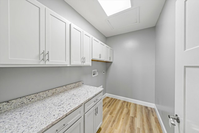 2137 Rainwater Rd, Dandridge, TN 37725 - washroom with cabinet space, hookup for a washing machine, baseboards, light wood-style flooring, and hookup for an electric dryer