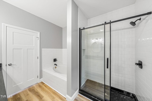 2137 Rainwater Rd, Dandridge, TN 37725 - bathroom with a shower stall, wood finished floors, and a bath