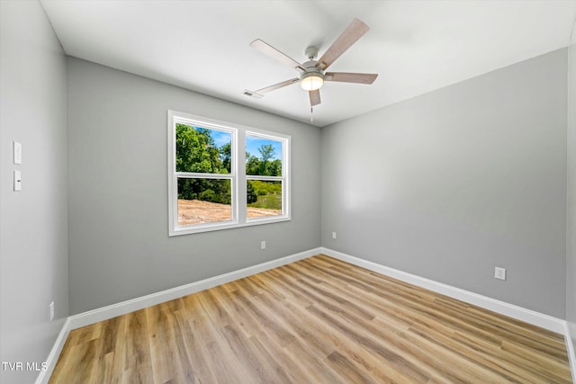 unfurnished room featuring ceiling fan and light wood-type flooring