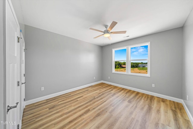 spare room featuring ceiling fan and light wood-type flooring