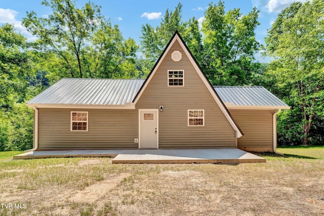 rear view of house featuring a patio