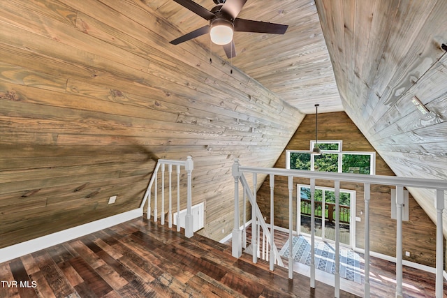 bonus room featuring wooden ceiling, dark wood-type flooring, wooden walls, vaulted ceiling, and ceiling fan