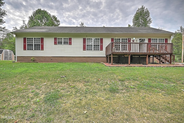 back of house with a wooden deck and a yard