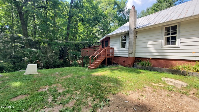 view of yard with a wooden deck