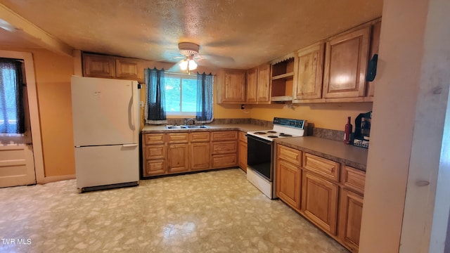 kitchen featuring sink, white appliances, a textured ceiling, and ceiling fan