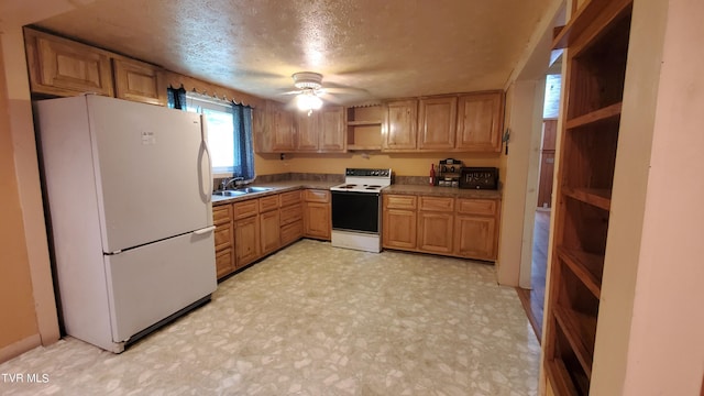 kitchen with ceiling fan, sink, a textured ceiling, and white appliances