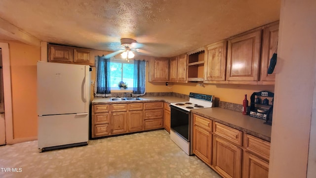 kitchen with ceiling fan, sink, a textured ceiling, and white appliances