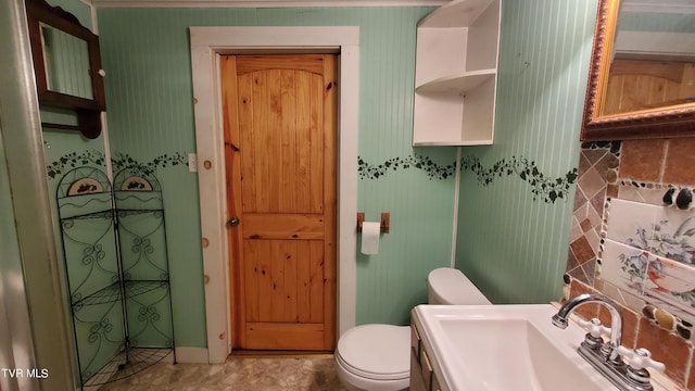 bathroom featuring sink and toilet