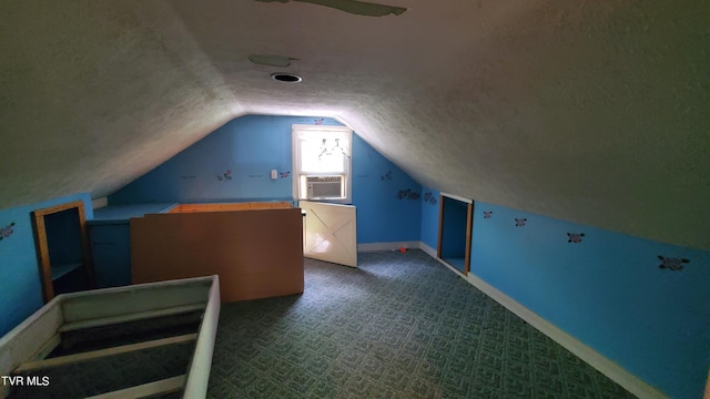 bonus room featuring cooling unit, lofted ceiling, carpet flooring, and a textured ceiling