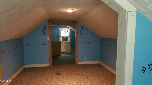 additional living space featuring carpet, cooling unit, lofted ceiling, and a textured ceiling