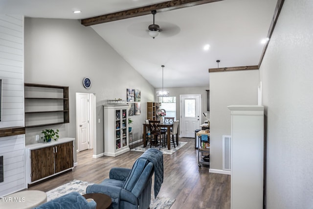 living room with beamed ceiling, ceiling fan, wood-type flooring, and high vaulted ceiling