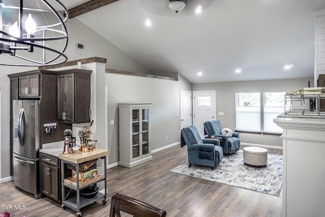 kitchen with hardwood / wood-style floors, high vaulted ceiling, stainless steel refrigerator with ice dispenser, beam ceiling, and dark brown cabinetry