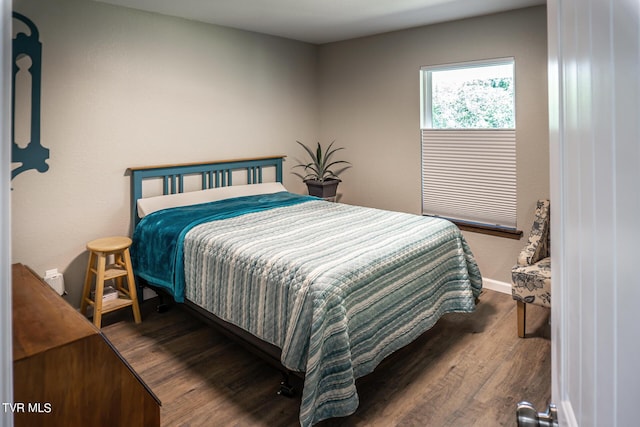 bedroom featuring dark hardwood / wood-style floors