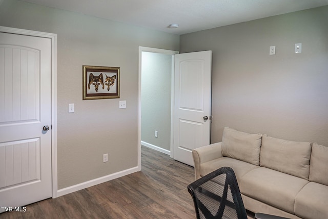 living room featuring dark wood-type flooring