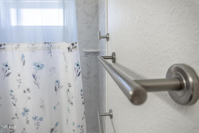 bathroom featuring curtained shower