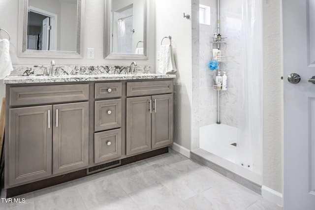 bathroom featuring vanity and walk in shower