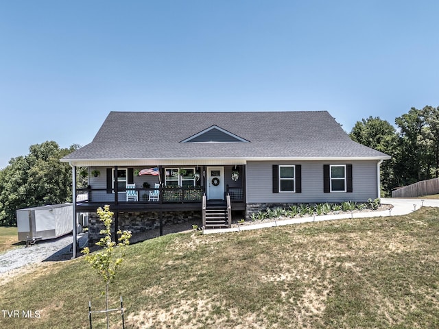 view of front of property featuring covered porch and a front yard