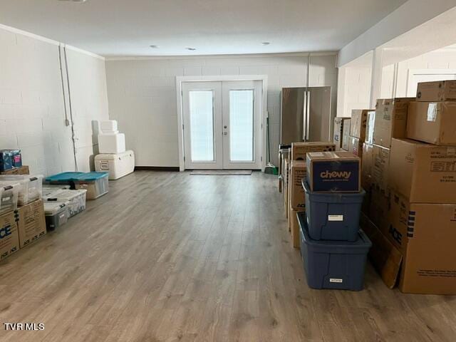 miscellaneous room with french doors and hardwood / wood-style flooring