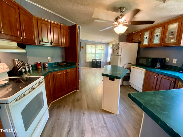 kitchen featuring light wood-type flooring, a textured ceiling, white appliances, and ceiling fan