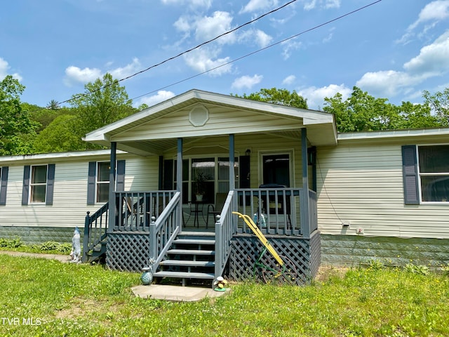 view of front of house with a porch and a front yard