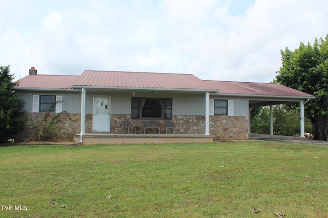 ranch-style home with a carport and a front yard