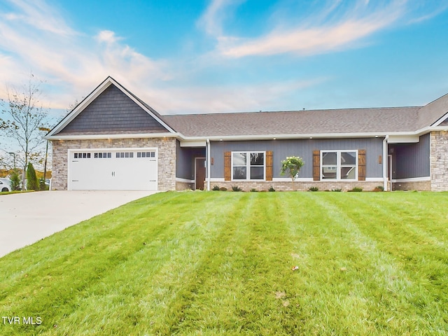 view of front of property with a garage and a front lawn