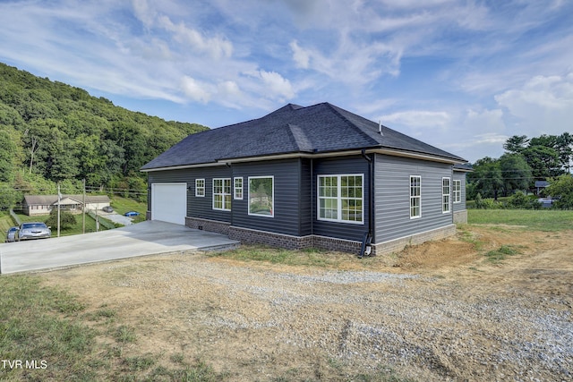 view of side of home with a garage