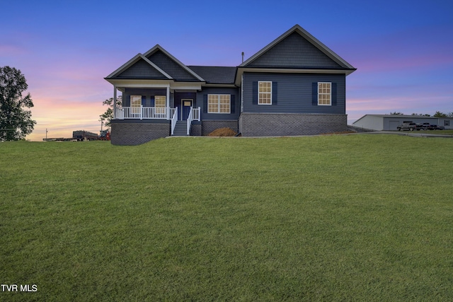 craftsman inspired home with a lawn and a porch