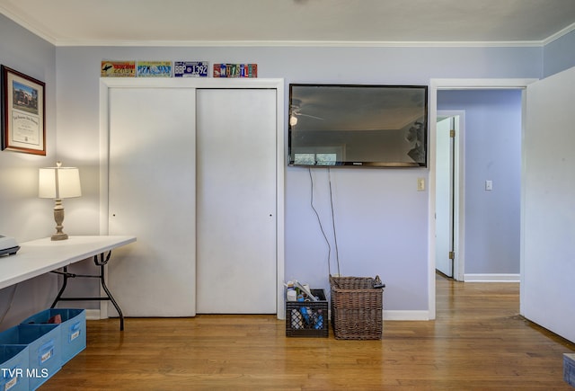 office space featuring hardwood / wood-style flooring and ornamental molding