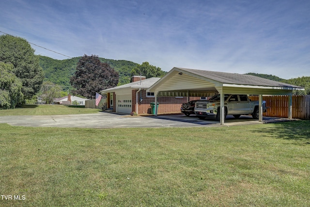 view of car parking featuring a lawn, a garage, and a carport