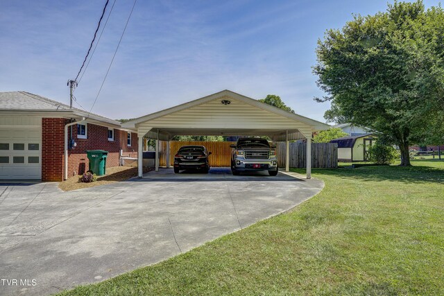 view of parking featuring a yard and a carport