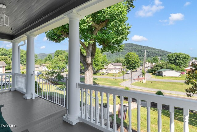 308 E Pearl Ave, Big Stone Gap, VA 24219 - wooden porch featuring a mountain view and a residential view
