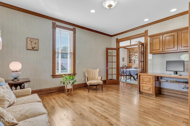 office with light hardwood / wood-style floors, french doors, and ornamental molding