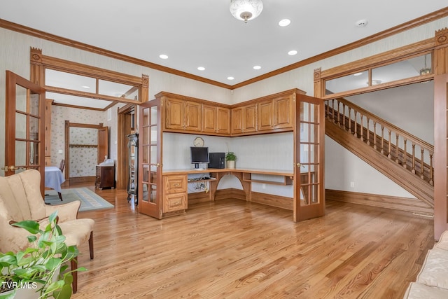 interior space with light hardwood / wood-style flooring, french doors, and crown molding