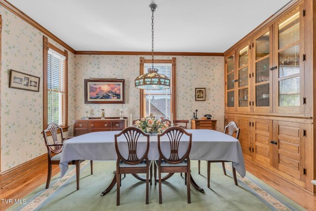 308 E Pearl Ave, Big Stone Gap, VA 24219 - dining area featuring wallpapered walls, plenty of natural light, crown molding, and wood finished floors