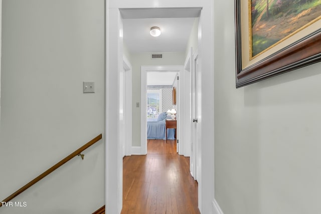 hallway with wood-type flooring