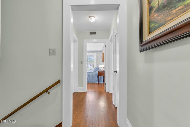 308 E Pearl Ave, Big Stone Gap, VA 24219 - hallway with wood finished floors and an upstairs landing