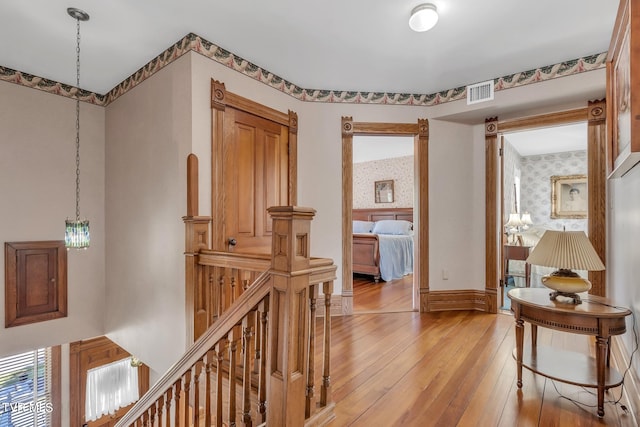 hall with light hardwood / wood-style flooring